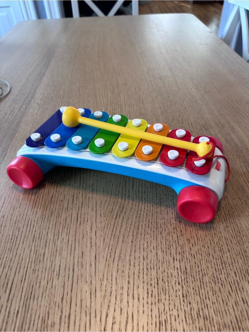 Fisher-Price Rainbow Metal Xylophone with Yellow Mallet and Red Wheels